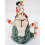 Equestrian: A Coronation Ware, Staffordshire teapot formed as a show jumping horse and rider,