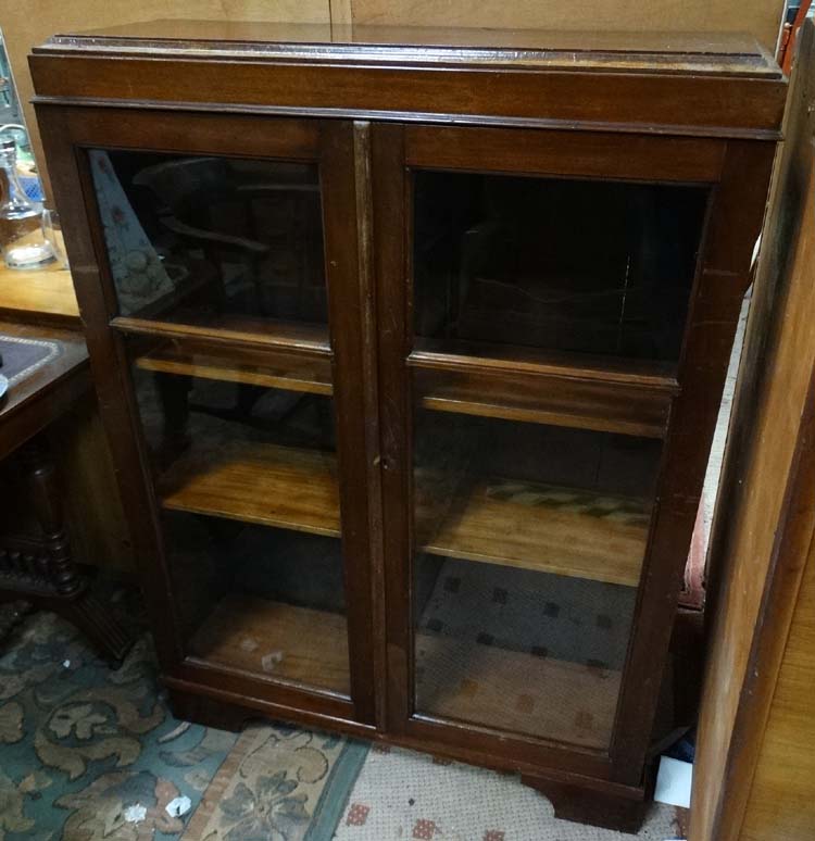 Glazed mahogany bookcase CONDITION: Please Note - we do not make reference to the