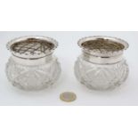 A pair of cut glass small pots / posy bowls with silver rims hallmarked Birmingham 1901 maker