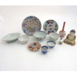 A collection of 11 Chinese and Japanese ceramic bowls and vases to include a blue and white Chinese