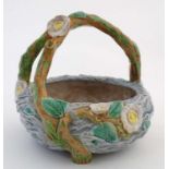 A 19thC Royal Worcester Majolica crab stock handled basket decorated with dog roses on a blue