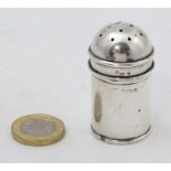 A silver pepperette of cylindrical form hallmarked Birmingham 1931 maker Northern Goldsmiths Co.