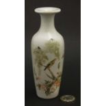 A small Chinese vase decorated with bird and insects in flowering Cherry blossom boughs ,