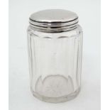 A Victorian glass dressing table jar with silver top hallmarked Birmingham 1896 maker Hilliard &