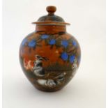 A small Chinese burnt orange ginger jar,