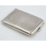 An Art Deco silver matchbook cover / vesta case with engine turned decoration.