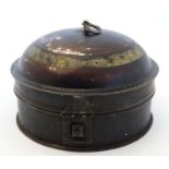 A 19thC toleware tin spice box of circular form with domed cover, remains of Japanned finish,