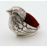 A Contemporary .925 silver pin cushion formed as a bird / chick with red velvet cushion to back .