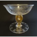 A pedestal comport / dish with etched decoration and gilt detail to stem.