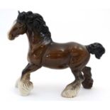 A Beswick model of a cantering Bay Shire horse in gloss finish, number 975,