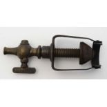 A Yates patent champagne tap , incorporating bottle stopper . 1 1/2'' wide.