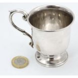 A silver christening mug with scroll handle hallmarked Birmingham c.1800 maker Thomas Ducrow.