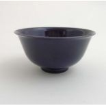 A Chinese small purple sang de beouf bowl, having purple glaze to interior and exterior,