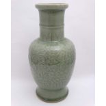 A Chinese Celadon green vase, decorated with clawed dragons amidst scrolling foliage. 13'' high.