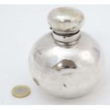A silver scent bottle of spherical form. Hallmarked London 1919.