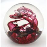 A 1991 Selkirk Glass, Scotland , 'Spindrift' paper weight in red and clear glass, inscribed to base.