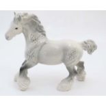 A Beswick model of a cantering Dapple Grey Shire Horse in gloss finish, number 975,