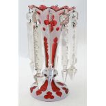 A white cut to cranberry glass table lustre centrepiece of trumpet form,