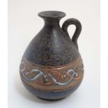 A Spanish Mejias Polonio Pottery pitcher,