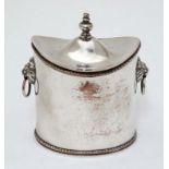A silver plate tea caddy of ovoid form with lions mask handles and hinged lid 4 1/2" high