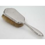 A silver mounted hair brush CONDITION: Please Note - we do not make reference to
