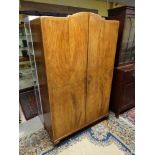 A 1950's Art Deco style quarter veneered 2 door wardrobe 77" high x 47" wide x 19 3/4" deep