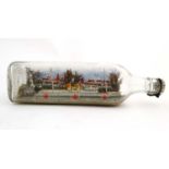 A Duars whiskey bottle containing diorama style model of the hospital ship Ocean Wave within.