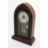 American Lancet Alarm Clock : a walnut cased , Lancet shaped ,