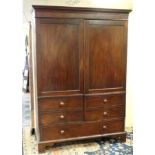 A Victorian mahogany Guernsey press / wardrobe with doors opening to reveal large hanging storage