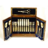 A Victorian oak cased canteen of close plate fruit eaters (12 place) with ivory handles,