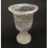 A rock crystal vase in the form of a pedestal goblet.