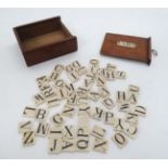 A set of Victorian bone A B C alphabet set of letters in original mahogany case with A B C plaque