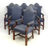 A set of 6 open arm dining chairs with shaped high backs and upholstered seats arms rests and back