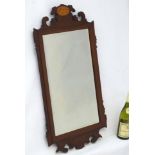 A 19thC Sheraton revival square bevelled mahogany framed mirror with inlay.