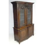An 18thC / 19thC Continental carved oak display buffet / Mueble deux corps 90 1/2" high x 58 1/4"