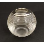 A glass bar top/ table top match striker of spherical glass form with ribbed sides and silver plate