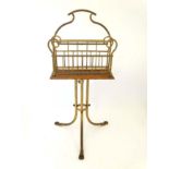 An Edwardian oak and brass magazine rack 31 3/4" high x 15" wide" CONDITION: Please