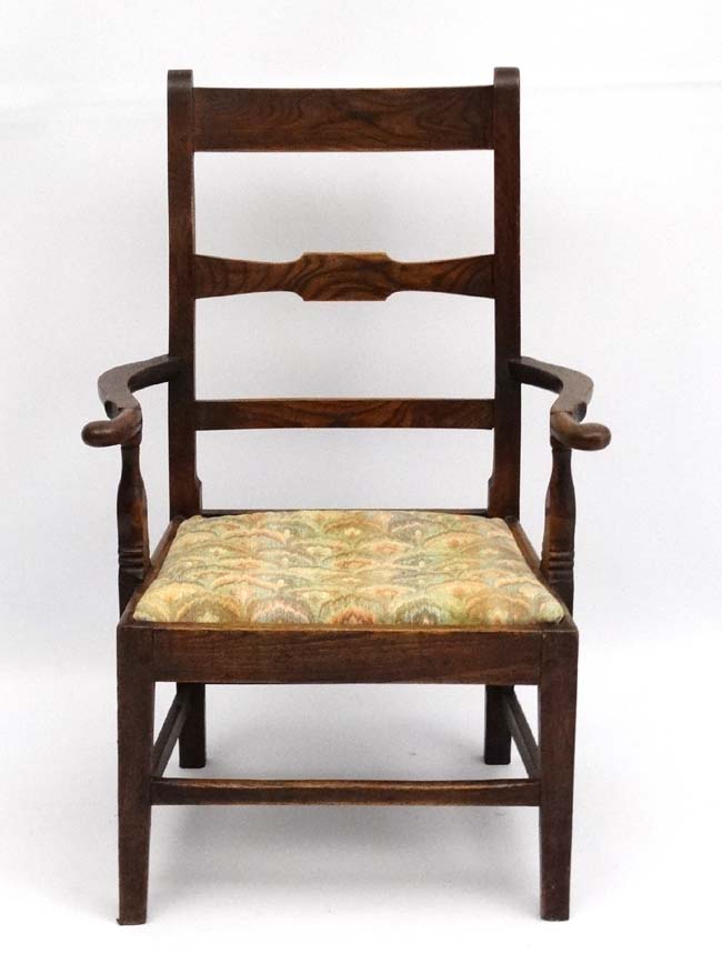 An early 19thC elm country made open armchair with drop in seat and squared tapering legs. - Image 3 of 3