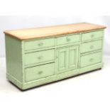 An Edwardian painted pine low dresser with 7 drawers with central lower cupboard 62 1/2" wide x 30"