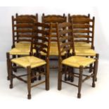 A set of 8 mid - late 20thC oak ladder back dining chairs with envelope rush seats 39" high