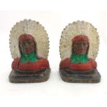 A pair of early - mid 20thC cold painted bronze book ends formed as Native American Indians.
