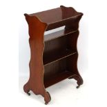 A late 19thC/early 20thC mahogany bookcase with book trough above,