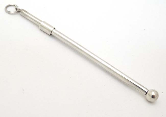 A silver and white metal swizzle stick 3 1/4" long (closed) CONDITION: Please Note - Image 4 of 4