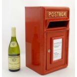A model of a red postbox ( with key 0 . 21stC.