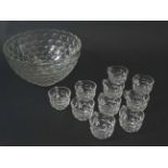 A mid 20thC glass punch bowl with 10 punch cups.