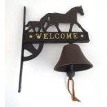 A painted cast metal wall hanging 'Mare & Foal' doorbell.