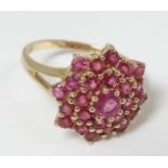 A 9ct gold ring set with pink stone cluster CONDITION: Please Note - we do not