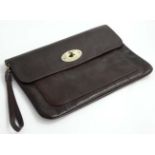 A brown leather Mulberry Bayswater laptop sleeve.