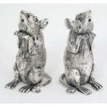 Novelty white metal salt and pepper pots formed as mice. marked 800 under.