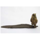 A 21stC novelty standish formed as an owl stoop upon a feather,